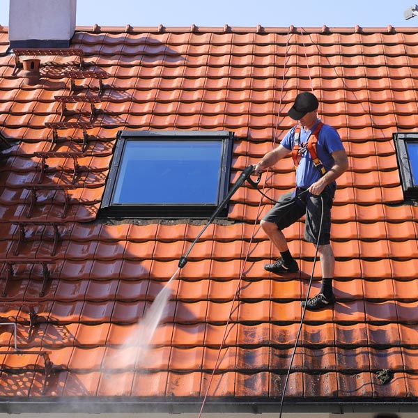 roof being pressure washed